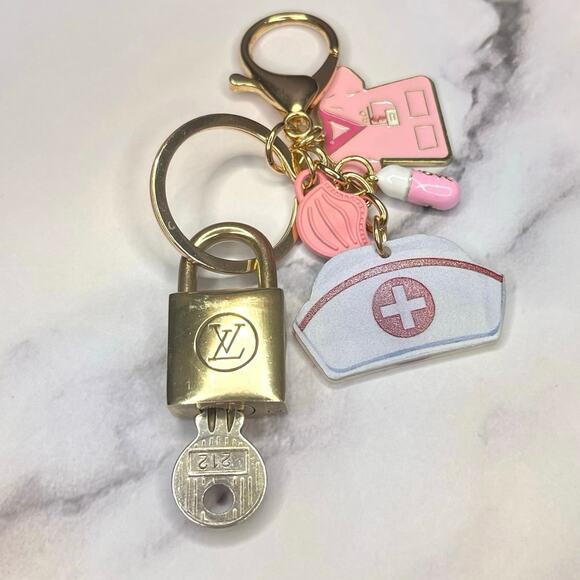 Louis Vuitton Vintage Lock & Key Set #212 w/ a Nurse-Themed Charms Keychain - Picture 1 of 5